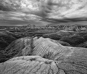 Rocks and formations under stormy skies in Badlands National Park, South Dakota. - South Dakota Photograph