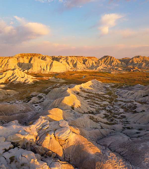 A vertical scenic photograph of the badlands Toadstool Geologic Park in western Nebraska. - Nebraska Photography