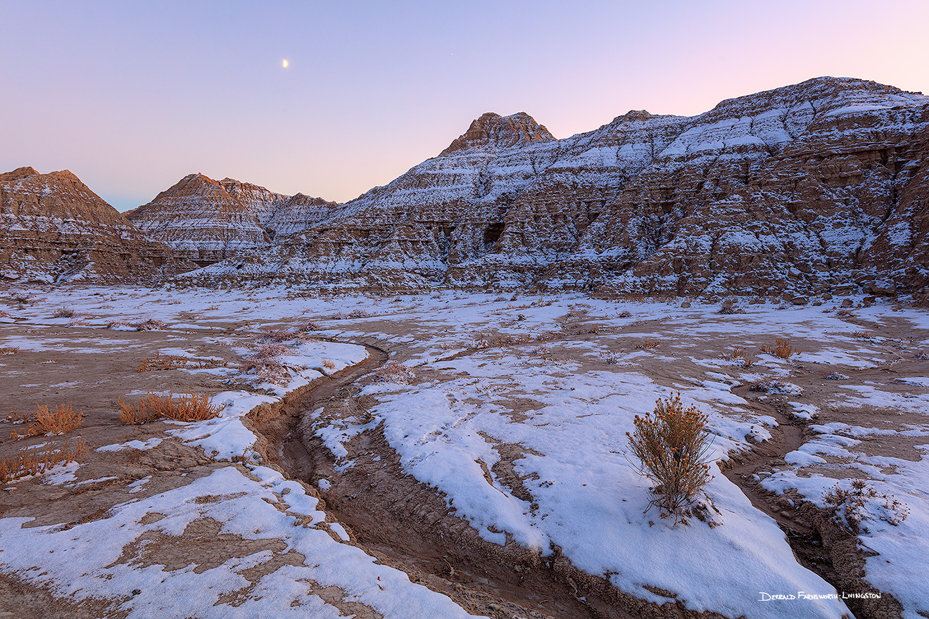 Scenic landscape photograph of a moonrise at Toadstool Geologic Park in western Nebraska after snow. - Nebraska Picture