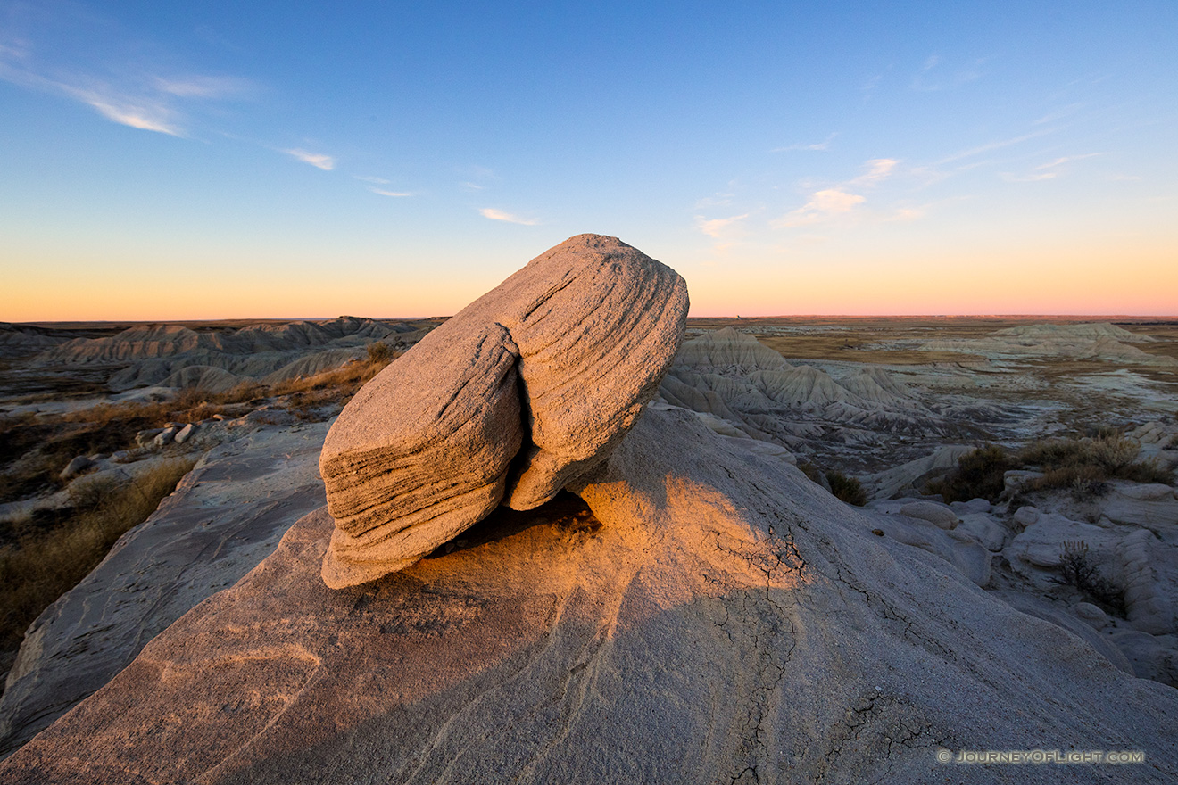 Scenic landscape photograph of Toadstool Geologic Park illuminated by last light in western Nebraska. - Nebraska Picture