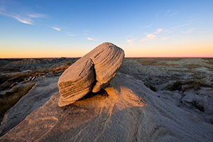 Scenic landscape photograph of Toadstool Geologic Park illuminated by last light in western Nebraska. - Nebraska Photograph