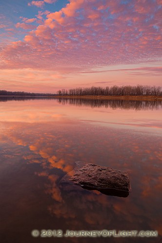With nary a breeze and no other soul in sight, I enjoyed the vibrant colors brought forth from this sunrise in a quiet peacefulness and solitude.