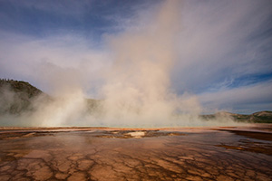 Steam from the Grand Prismatic Spring in the Middle Geyser basin rises with a warm hue from the early morning sun. - Wyoming Landscape Photograph