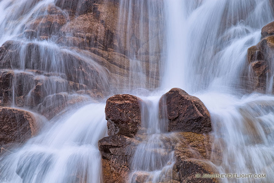 In the spring, the water flows down from Lawn Lake to the Alluvial Fan in a greater volume than the rest of the year, cascading over the rocks. - Rocky Mountain NP Photography