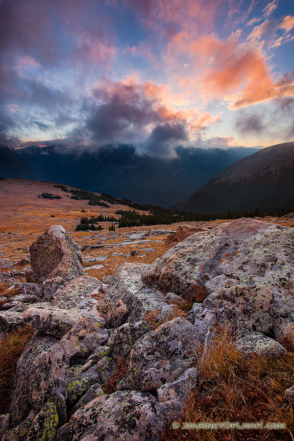 There was a chill in the air as evening descended across Rocky Mountain National Park.  From the treeless tundra, the view of the valley was uninhibited while the clouds rolled across the tips of the mountains.  It is during these times I fully comprehend the feelings described by John Denver in his songs. - Colorado Photography