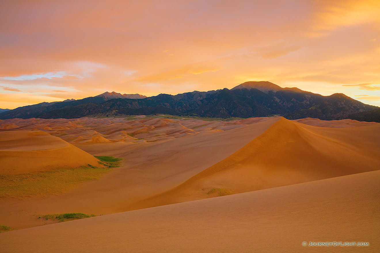 With no wind there is a complete silence on the dunes while the sunrise bathes the landscape in a warm glow a Great Sand Dunes National Park, Colorado. - Great Sand Dunes NP Picture
