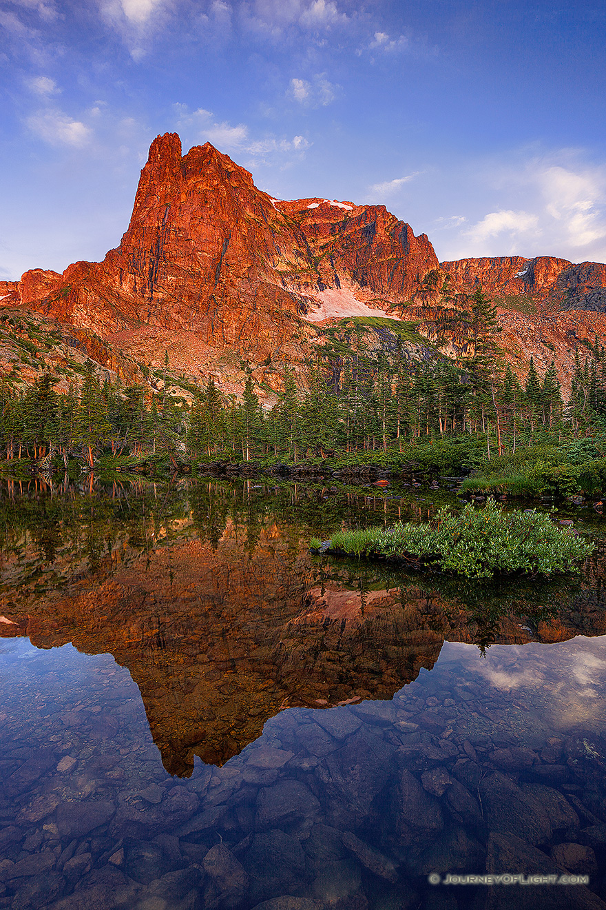 I had first hiked to Lake Helene about 5 years prior on a crisp fall day and on that visit became one of my favorite locations in Rocky Mountain National Park.  I took another opportunity to visit this scenic location, this time in the summer.  As the sun rose, Notchtop glowed with a brilliant warmth similar to what I had witnessed on the prior visit.  This year, however, the water was calm and reflected the beautiful scene that was before me. - Rocky Mountain NP Picture
