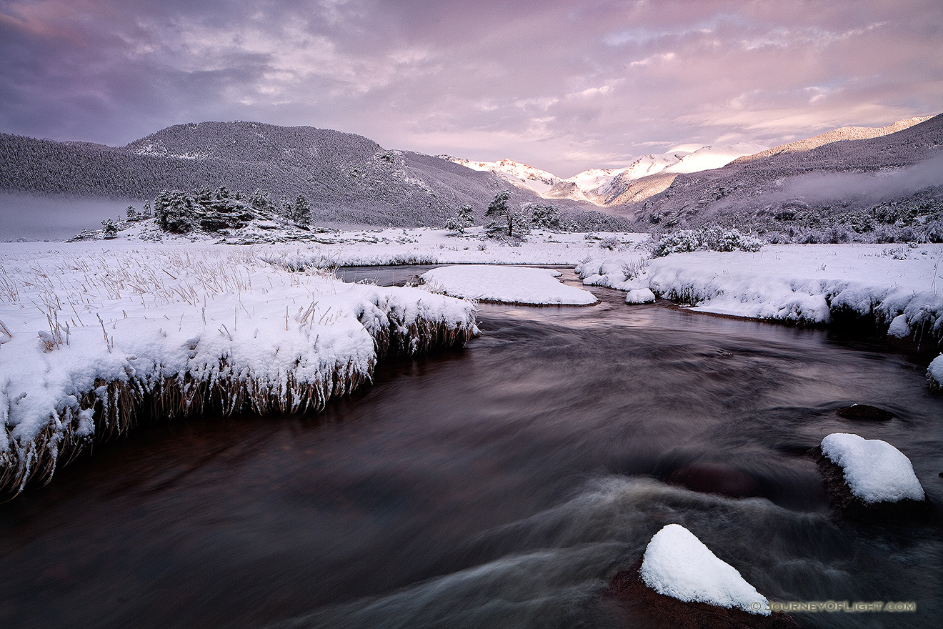 On a cold day in mid-May, the Big Thompson flows through Moraine Park as the first sunlight of the day illuminates the peaks of the Continential Divide. - Rocky Mountain NP Picture