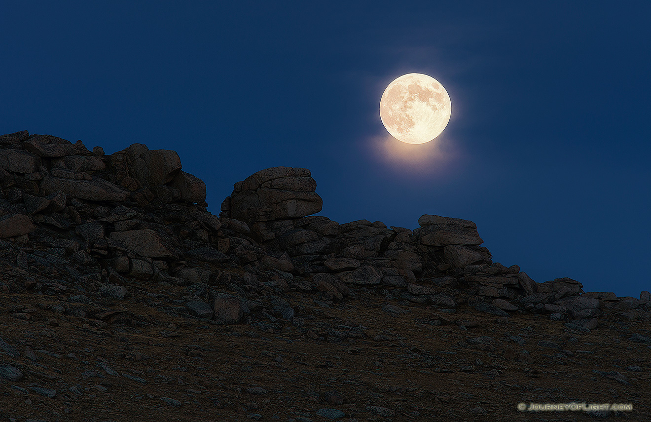 As the sun descended in the west, an eerie glow began to illuminate the east.  Within a few minutes the glowing orb of the moon rose silently above the tundra. - Colorado Picture