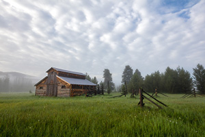 Fog rolls through the Kawuneeche Valley and surrounds this old rustic barn in Rocky Mountain National Park. - Colorado Landscape Photograph