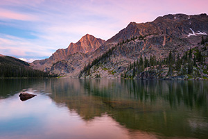 Nestled under Andrews Peak, dusk falls on the beautiful Nanita Lake in the backcountry of Rocky Mountain National park. - Colorado Landscape Photograph