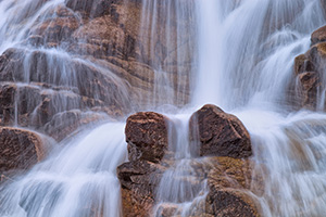 In the spring, the water flows down from Lawn Lake to the Alluvial Fan in a greater volume than the rest of the year, cascading over the rocks. - Colorado Landscape Photograph