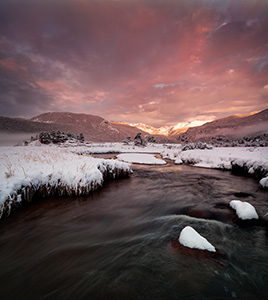On a cold day in mid-May, the Big Thompson flows through Moraine Park as the first sunlight of the day illuminates the peaks of the Continential Divide. - Colorado Landscape Photograph