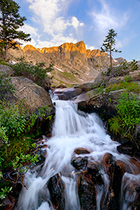 A scenic landscape photograph of a waterfall below Mirror Lake in the Rocky Mountain National Park, Colorado. - Colorado Photograph