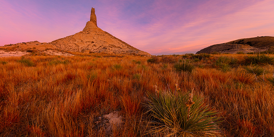 A scenic panoramic landscape Nebraska photograph of a sunset and Chimney Rock in western Nebraska. - Nebraska Photography