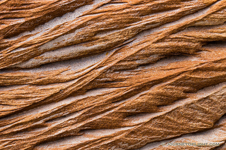 An abstract pattern caused by erosion in rocks embedded in the bluffs in Theodore Roosevelt National Park. - North Dakota Photography