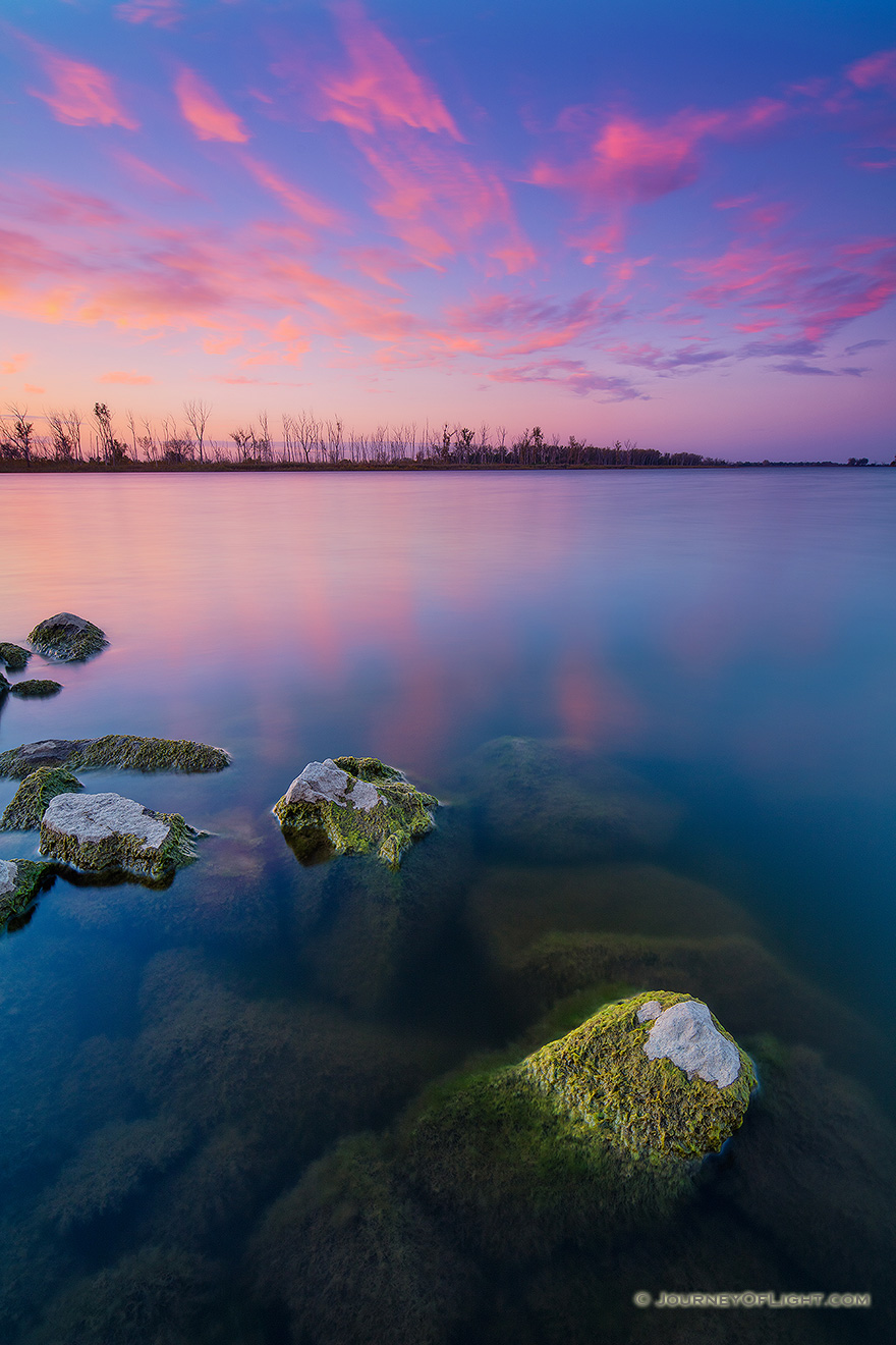 Quiet.  Peaceful.  The day ends with pink clouds and a purplish sky in the distance.  All is quiet save for the rustling of the nearby cottonwoods from a gentle easterly breeze.  This is my favorite time of the day, the time when shadows grow long and colors vivid. - DeSoto Picture