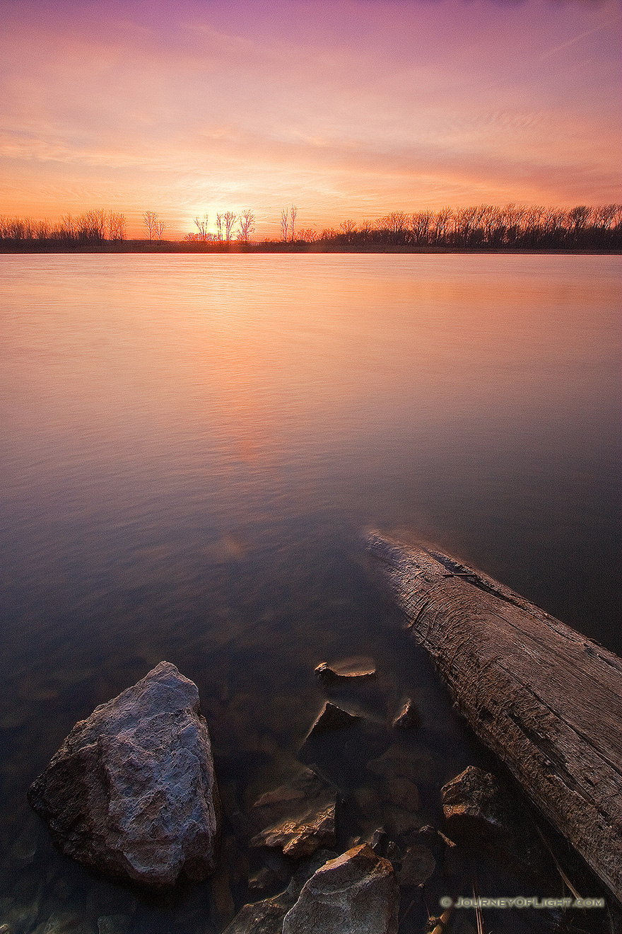 Clouds in the sky reflect the setting sun as sunset decends upon DeSoto Bend National Wildlife Refuge. - DeSoto Picture