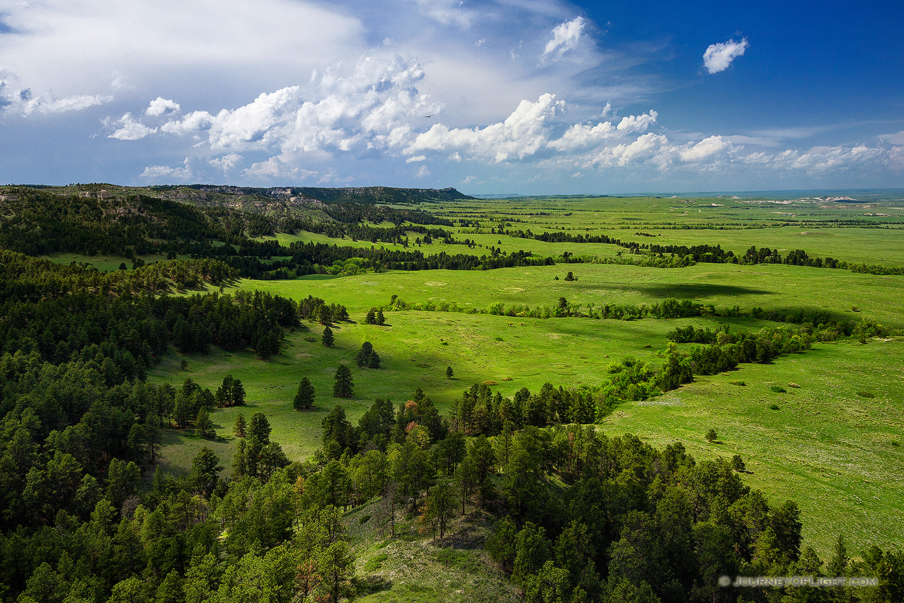 Gilbert-Baker WMA is part of the Pine Ridge escarpment in extreme western Nebraska.  It is so close to Wyoming, in fact, that the ridge that is furthest in the distance is the state border.  On this spring day I watched as storm clouds rolled through dropping rain and leaving everything a verdant green. - Nebraska Picture