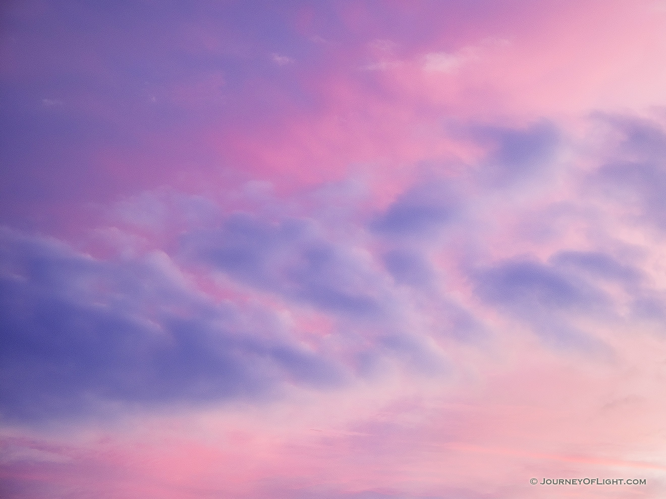 During a colorful sunrise the clouds are briefly illuminated. - Nebraska Picture