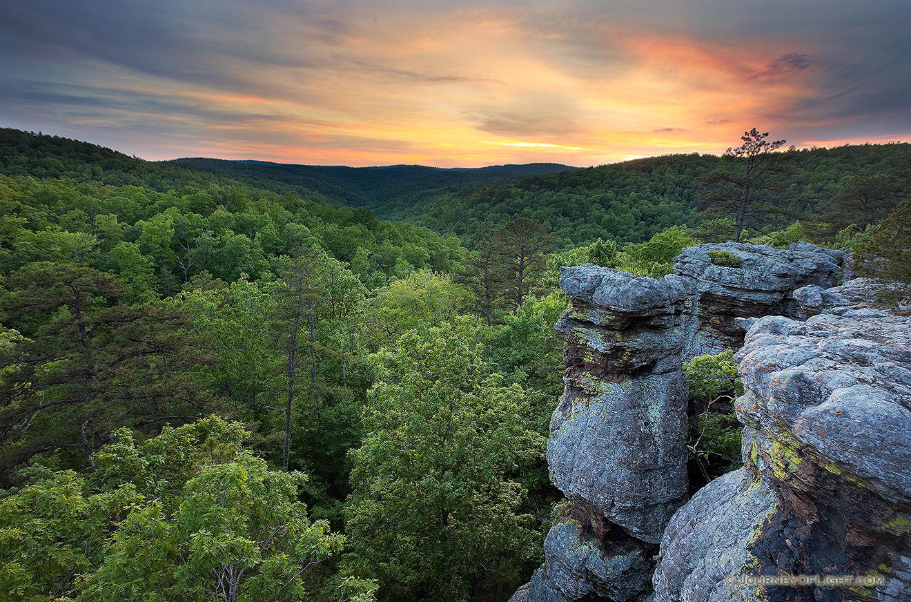 The last light of evening illuminates the clouds on the Kings Bluff trail in the Ozarks in Arkansas. - Arkansas Picture