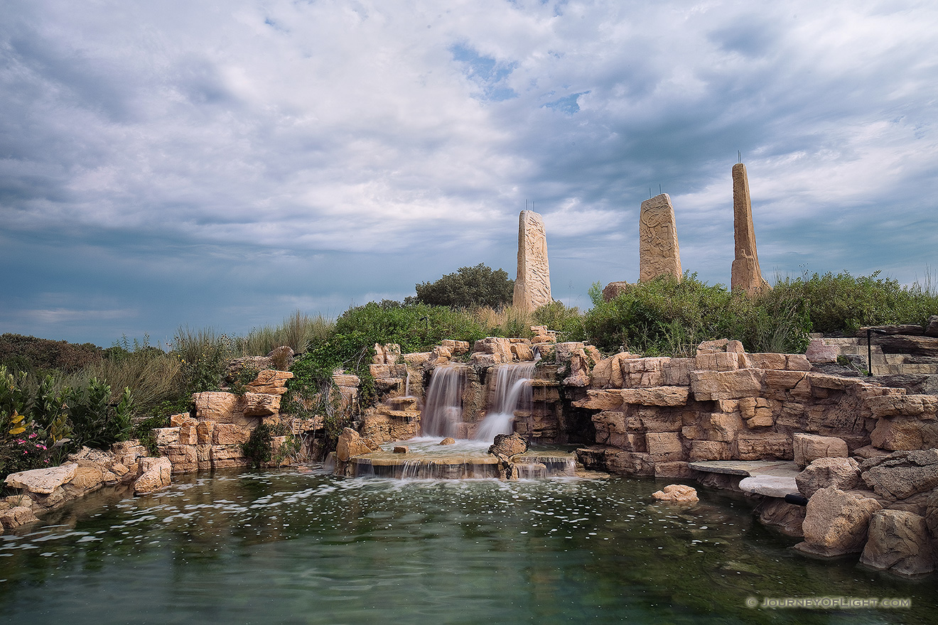 Ponca State Park in northeastern Nebraska features the 'Towers of Time' monument, created by Jay Tschetter and it represents various eras in Earth's past:
				<p>The 25-foot tower on the left depicts the late Cretaceous Period (65 million to 99 million years ago) when Nebraska was under water. This was the age of the dinosaurs and displays prehistoric sea and land creatures.
				<p>The 27-foot center tower features species from the Pleistocene Period (1.8 million to 10,000 years ago). This was during the Ice Age when woolly mammoths, saber-toothed cats and giant sloths roamed the Earth.
				<p>The 25-foot tower on the right features a collection of modern animals, everything from blue herons to buffalo that inhabit the Missouri River region.
				<p>The square fountain includes images of indigenous people from the Folsom culture, Paleolithic period, Earth Mound Builders and recent Natives who occupied the region in the 1800s.
			 - Ponca SP Picture