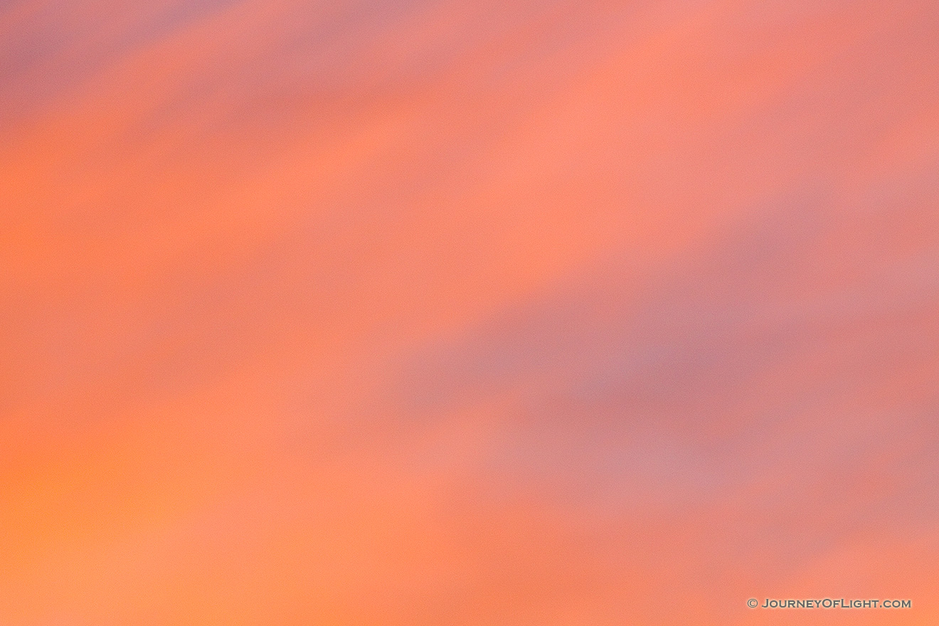 The setting sun illuminates these clouds with warm, inviting colors. - Nebraska Picture