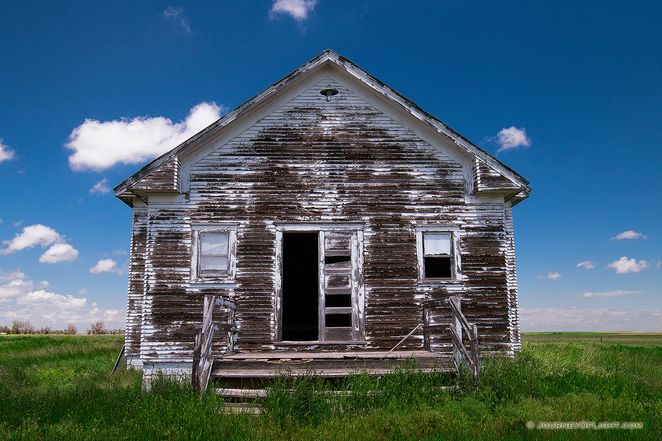 An old abandoned one room schoolhouse sits on the side of the highway near Hemingford, Nebraska. - Nebraska Picture