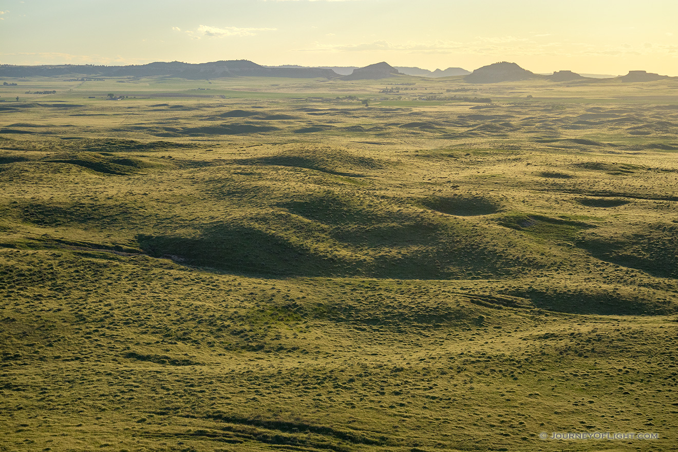 To the west of Chimney Rock the sky glows warm with the light of the setting sun. - Nebraska Picture