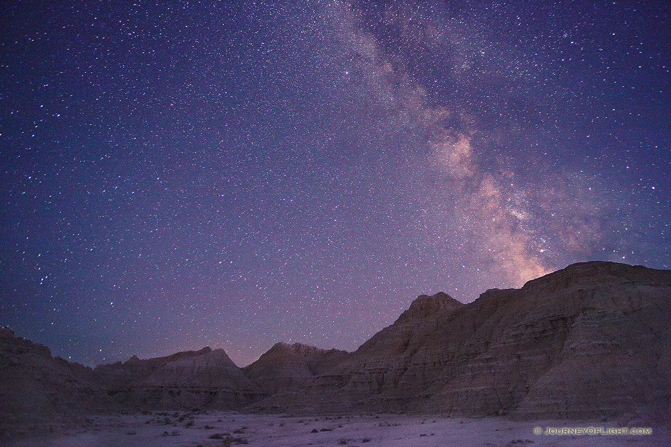 An arm of the Milky Way appears to flow out of the rocks at Toadstool Geologic Park in western Nebraska. - Toadstool Picture