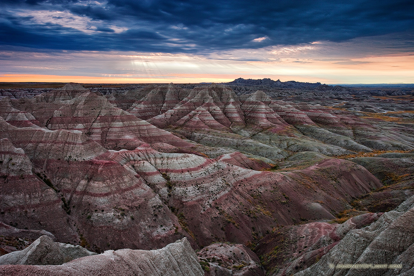 Early morning rays illuminate the Badlands in Badlands National Park, South Dakota.  Originally designated a National Monument, Badlands National Park was redesignated a National Park on November 10, 1978. - Badlands NP Picture