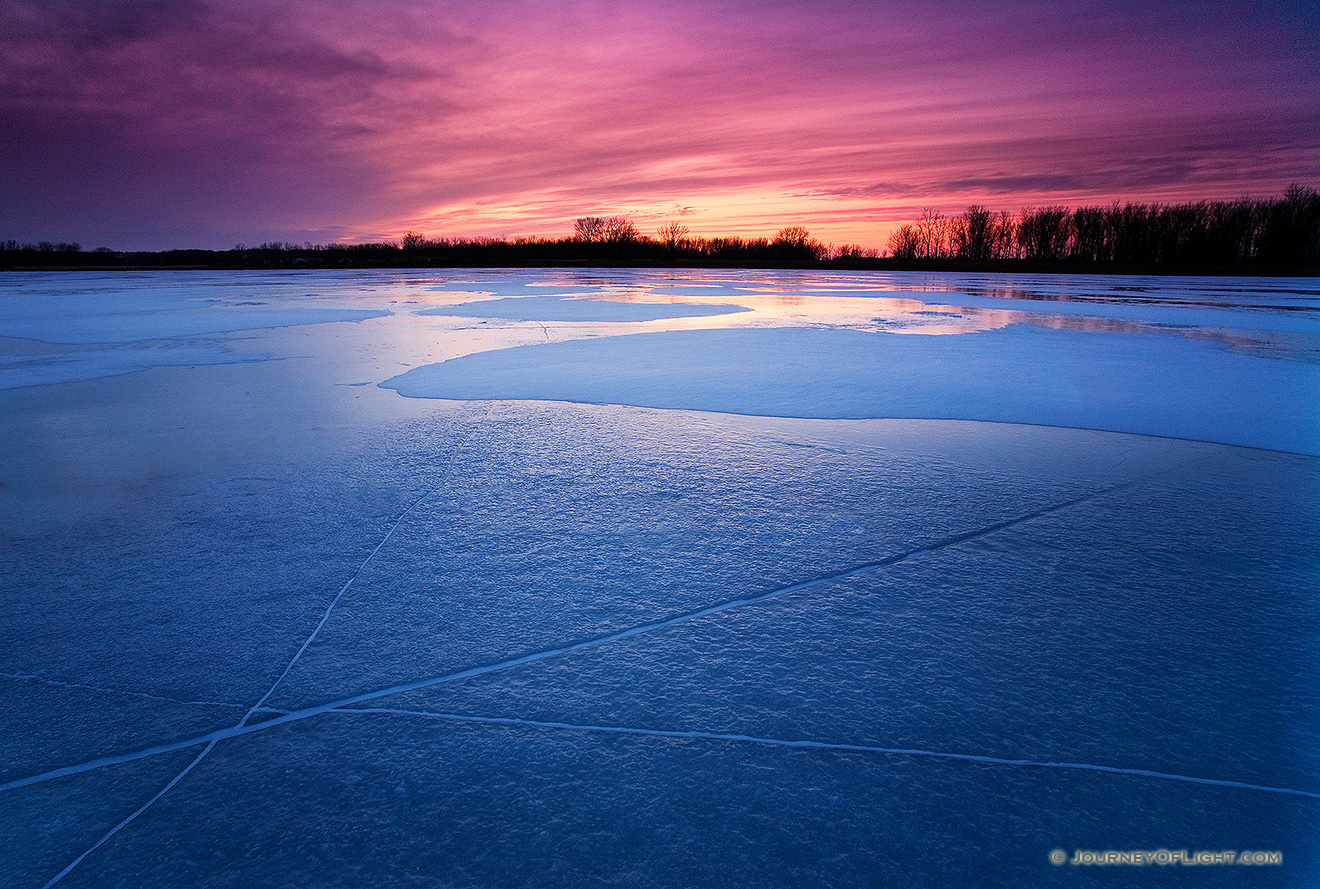 The former oxbow of the Missouri River, DeSoto Bend is completely frozen on a frigid January evening. - DeSoto Picture