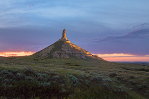 A scenic landscape Nebraska photograph of Chimney Rock illuminated at night. - Nebraska Photograph