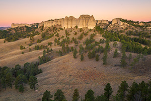 A scenic landscape photograph of the sunrise on the Red Cloud Buttes at Ft. Robinson in Northwestern Nebraska. - Nebraska Landscape Photograph