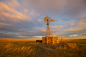 Scenic landscape photograph of a windmill at sunset at Oglala National Grasslands. - Nebraska Photograph