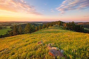 A beautiful sunrise illuminates the hills of Wind Cave National Park in South Dakota. - South Dakota Photograph