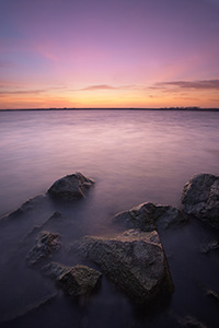 Just before sunrise on a fall morning, the early morning light begins to illuminate Branched Oak Lake in Lancaster County, Nebraska. - Nebraska Photograph