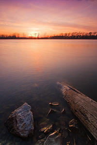 Clouds in the sky reflect the setting sun as sunset decends upon DeSoto Bend National Wildlife Refuge. - Nebraska Photograph