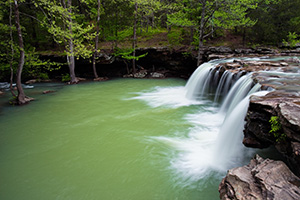 Water falls over Falling Water Falls just east of Pelsor (Sand Gap) Arkansas in the Ozark Mountains. - Arkansas Photograph