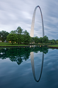 The Gateway Arch and its reflection at the Jefferson National Expansion Memorial in St. Louis, Missouri.  In 1980, Kenneth Swyers tried to parachute onto the Gateway Arch, he succeeded in reaching the structure, however, he failed in his subsequent base jump attempt, sliding down one side to his death.  - Missouri Photograph