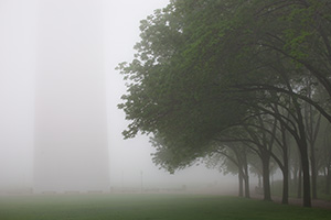 Through the thick fog the Gateway Arch in St. Louis is barely visible. - Missouri Photograph