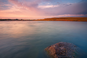 Just after sunrise on a summer's morning, warm light illuminates Powder Creek Wildlife Management Area in northwestern Nebraska. - Nebraska Photograph