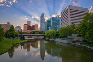 During a spring evening in Omaha, Nebraska I witnessed some spectacular godbeams.  This is the Gene Leahy Mall which runs down the center of downtown. - Nebraska Photograph