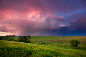 A fierce midwestern storm filled with lightning, moves quickly east across the Nebraska plains into Iowa. - Nebraska Photograph