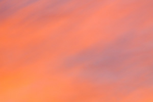 The setting sun illuminates these clouds with warm, inviting colors. - Nebraska Photograph