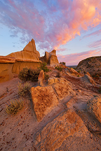 Clouds illuminated by the morning sun swirl above the badlands in western North Dakota in Theodore Roosevelt National Park. - North Dakota Photograph