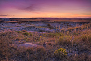 20 minutes past sunset, the very last light of the setting sun gives the prairie off of the Hudson-Meng Trail of the Oglala National Grassland an ethereal glow. - Nebraska Photograph