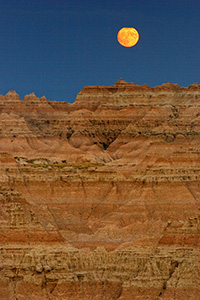 The full moon rises above the Badlands. - South Dakota Photograph