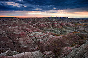 Early morning rays illuminate the Badlands in Badlands National Park, South Dakota.  Originally designated a National Monument, Badlands National Park was redesignated a National Park on November 10, 1978. - South Dakota Photograph