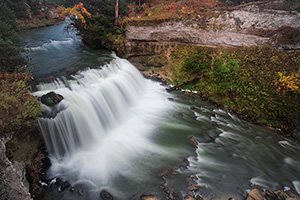 Not far from Merritt Reservoir in Cherry County, Nebraska, water flows over Snake River Falls. - Nebraska Photograph